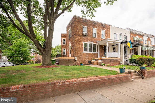 4800 Illinois Ave NW, Washington, DC 20011 - view of front of house featuring a front yard, brick siding, a porch, and cooling unit