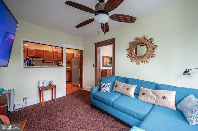 4800 Illinois Ave NW, Washington, DC 20011 - living room featuring a ceiling fan and baseboards