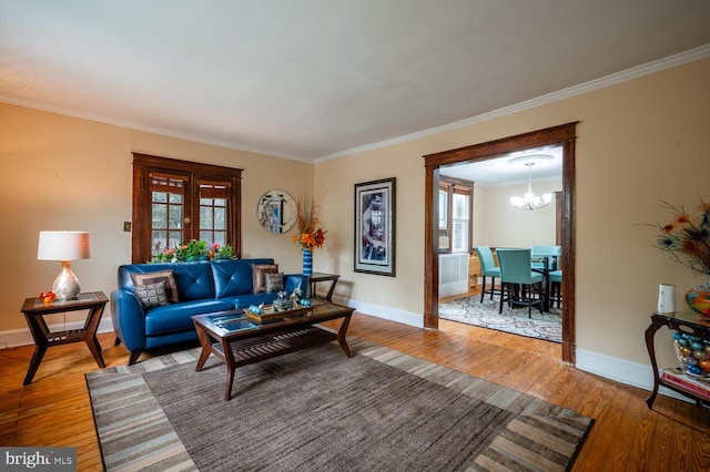 4800 Illinois Ave NW, Washington, DC 20011 - living area featuring ornamental molding, wood finished floors, a chandelier, and baseboards