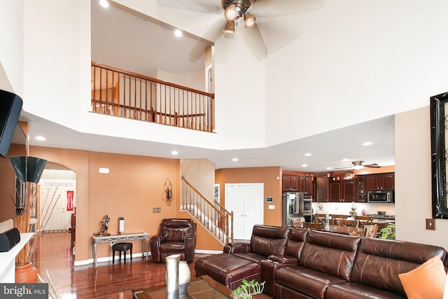13763 Deacons Way, Gainesville, VA 20155 - living room with ceiling fan, a high ceiling, wood finished floors, recessed lighting, and arched walkways