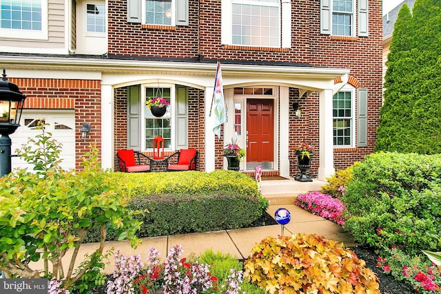 13763 Deacons Way, Gainesville, VA 20155 - view of exterior entry with brick siding and a porch