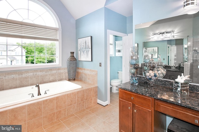 13763 Deacons Way, Gainesville, VA 20155 - full bathroom featuring tile patterned floors, vaulted ceiling, toilet, a garden tub, and vanity