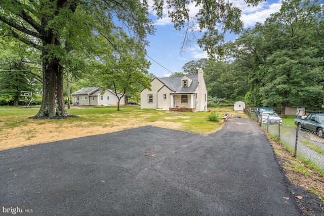 2908 Parkland Dr, District Heights, MD 20747 - view of front facade with a chimney and driveway