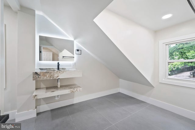 2908 Parkland Dr, District Heights, MD 20747 - additional living space featuring baseboards, a sink, and tile patterned flooring
