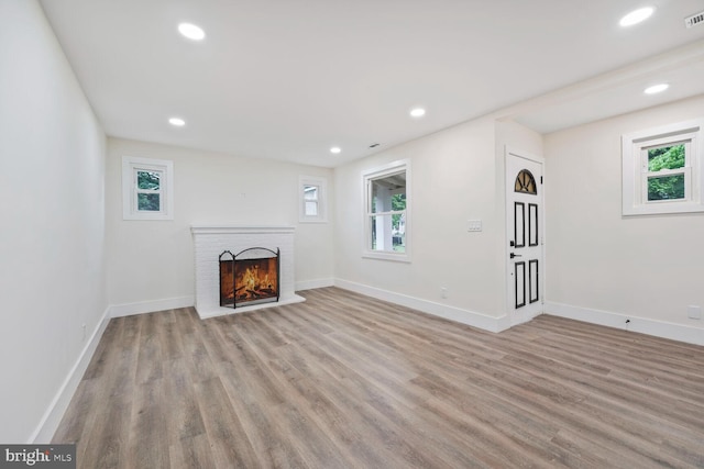 2908 Parkland Dr, District Heights, MD 20747 - unfurnished living room with light wood finished floors, plenty of natural light, and recessed lighting