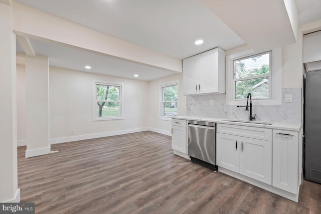 2908 Parkland Dr, District Heights, MD 20747 - kitchen featuring dishwasher, a sink, wood finished floors, decorative backsplash, and recessed lighting
