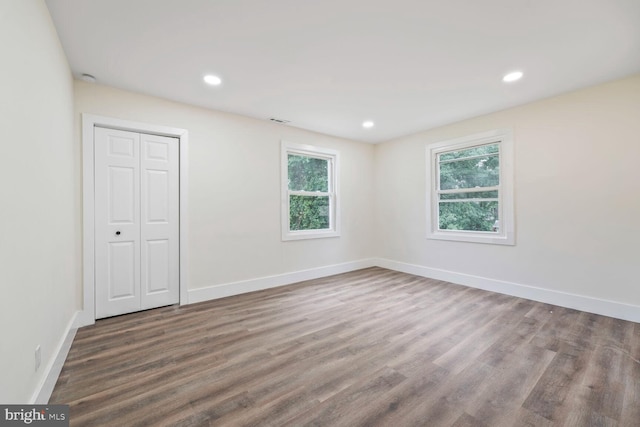 2908 Parkland Dr, District Heights, MD 20747 - unfurnished bedroom with wood finished floors, baseboards, recessed lighting, and a closet