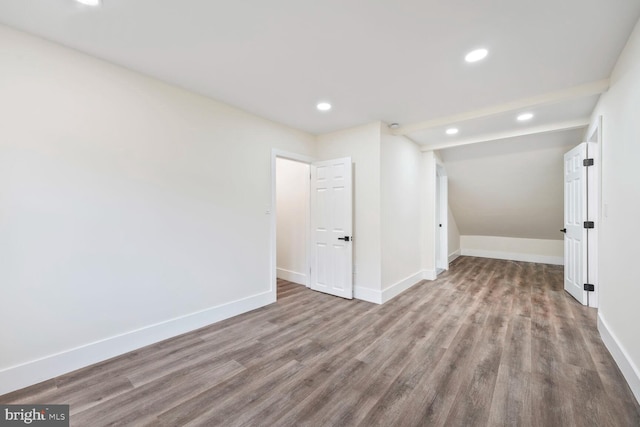 2908 Parkland Dr, District Heights, MD 20747 - spare room with wood finished floors, recessed lighting, baseboards, and lofted ceiling