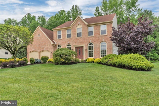 3026 5th St S, Voorhees, NJ 08043 - colonial house featuring brick siding, a front lawn, and an attached garage