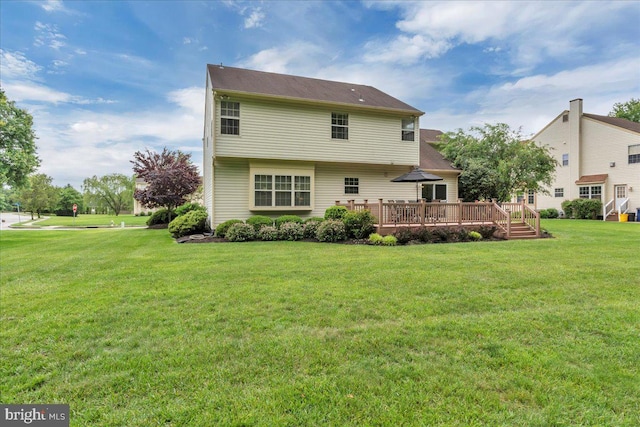 3026 5th St S, Voorhees, NJ 08043 - rear view of property featuring a deck and a lawn