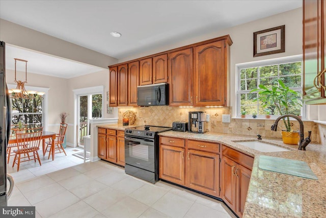 3026 5th St S, Voorhees, NJ 08043 - kitchen with black appliances, a sink, a chandelier, backsplash, and recessed lighting