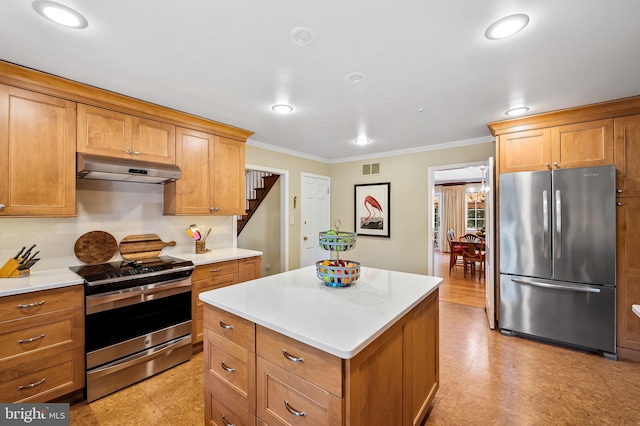 5702 Ainsley Garth, Baltimore, MD 21212 - kitchen featuring appliances with stainless steel finishes, under cabinet range hood, crown molding, light countertops, and a kitchen island