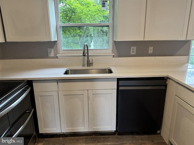 15368 Blacksmith Ter, Woodbridge, VA 22191 - kitchen with dishwashing machine, a sink, double oven range, and white cabinetry