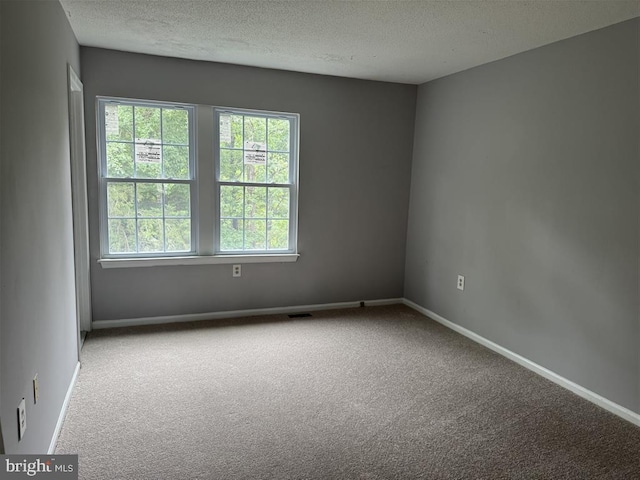15368 Blacksmith Ter, Woodbridge, VA 22191 - unfurnished room featuring carpet, a textured ceiling, and baseboards
