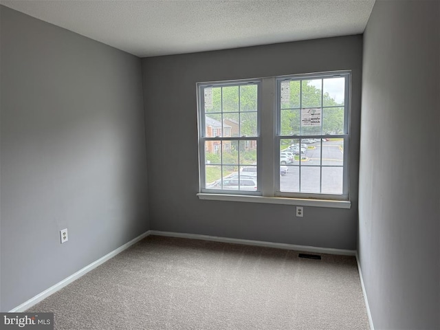 15368 Blacksmith Ter, Woodbridge, VA 22191 - unfurnished room with carpet, baseboards, and a textured ceiling