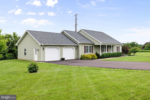 660 Bissetts Ln, Bloomsburg, PA 17815 - ranch-style home featuring a shingled roof, a garage, asphalt driveway, and a front yard