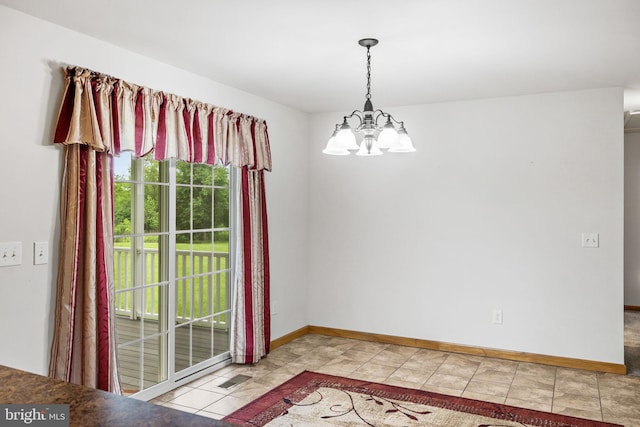 660 Bissetts Ln, Bloomsburg, PA 17815 - unfurnished dining area with a chandelier and baseboards