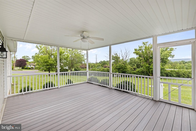 660 Bissetts Ln, Bloomsburg, PA 17815 - unfurnished sunroom with ceiling fan and view of wooded area