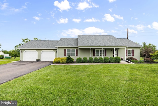 660 Bissetts Ln, Bloomsburg, PA 17815 - view of front of home with driveway, a garage, a front yard, and a shingled roof