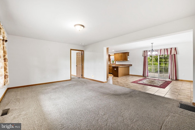 660 Bissetts Ln, Bloomsburg, PA 17815 - unfurnished living room featuring baseboards, light carpet, and a chandelier