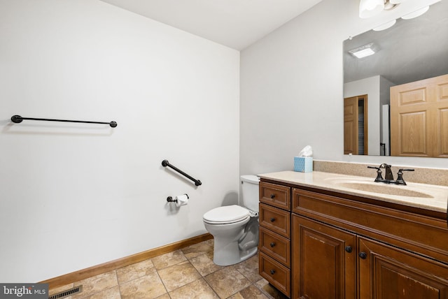 660 Bissetts Ln, Bloomsburg, PA 17815 - bathroom with vanity, baseboards, and toilet