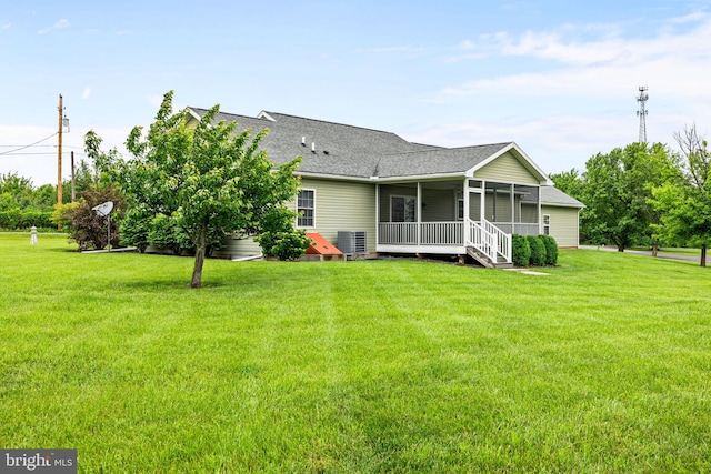 660 Bissetts Ln, Bloomsburg, PA 17815 - rear view of property with central AC unit, a shingled roof, and a yard