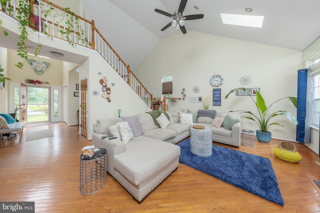 211 Spruce Trl, Woolwich Twp, NJ 08085 - living room featuring ceiling fan, high vaulted ceiling, stairway, wood finished floors, and a skylight