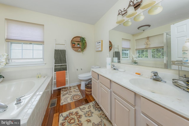 211 Spruce Trl, Woolwich Twp, NJ 08085 - bathroom featuring wood finished floors, a garden tub, and double vanity