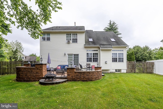 211 Spruce Trl, Woolwich Twp, NJ 08085 - back of house featuring a fire pit, a fenced backyard, a patio area, and a shingled roof