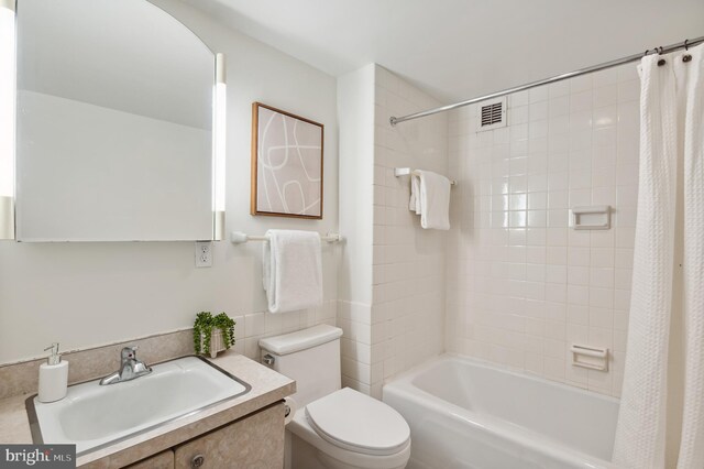 4100 Cathedral Ave NW Unit 709, Washington, DC 20016 - bathroom featuring toilet, vanity, and shower / bath combination with curtain