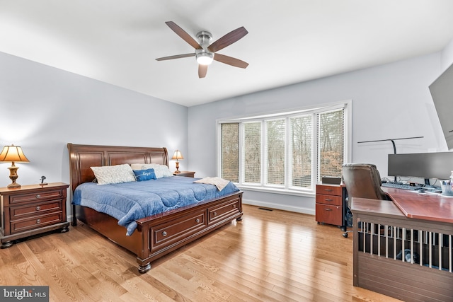 3420 Ponds Wood Ct, Huntingtown, MD 20639 - bedroom featuring light wood-style flooring, a desk, and ceiling fan