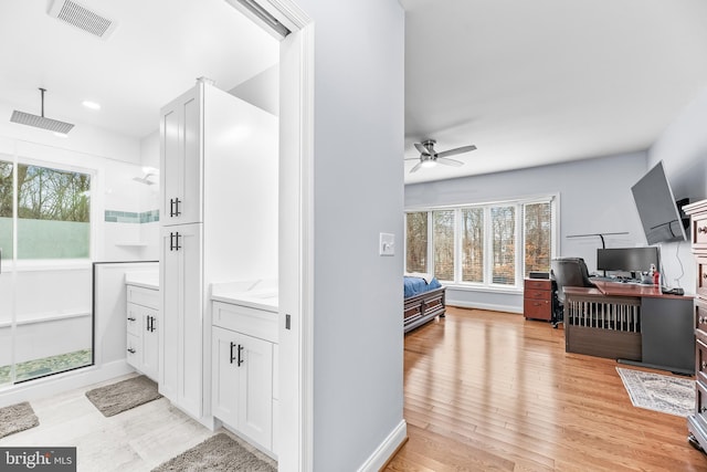3420 Ponds Wood Ct, Huntingtown, MD 20639 - ensuite bathroom featuring ceiling fan, a stall shower, and wood finished floors