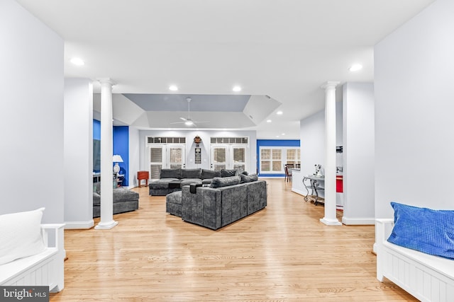 3420 Ponds Wood Ct, Huntingtown, MD 20639 - living area with ornate columns, a tray ceiling, light wood-style floors, ceiling fan, and recessed lighting