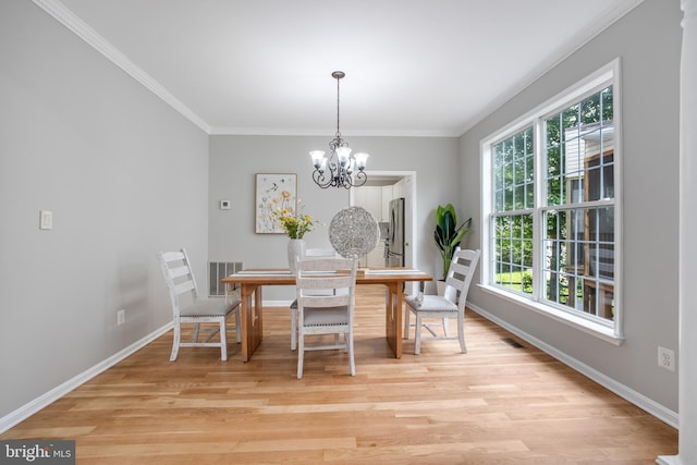 47561 Hidden Cove Ct, Sterling, VA 20165 - dining space featuring baseboards, light wood-type flooring, ornamental molding, and a chandelier