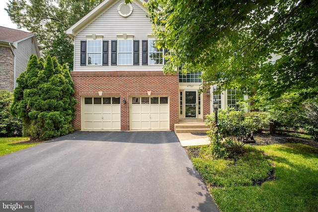 47561 Hidden Cove Ct, Sterling, VA 20165 - view of front of property featuring asphalt driveway, brick siding, and a garage