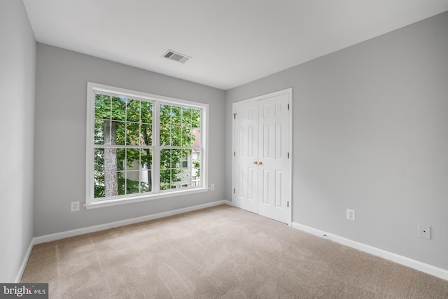 47561 Hidden Cove Ct, Sterling, VA 20165 - unfurnished bedroom with multiple windows, baseboards, carpet, and a closet