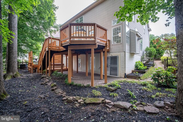 47561 Hidden Cove Ct, Sterling, VA 20165 - back of house with stairs, a wooden deck, and brick siding