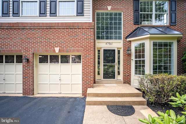 47561 Hidden Cove Ct, Sterling, VA 20165 - entrance to property with a garage, brick siding, and driveway