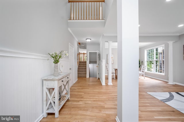 47561 Hidden Cove Ct, Sterling, VA 20165 - entryway featuring ornate columns, light wood-style floors, crown molding, stairway, and recessed lighting