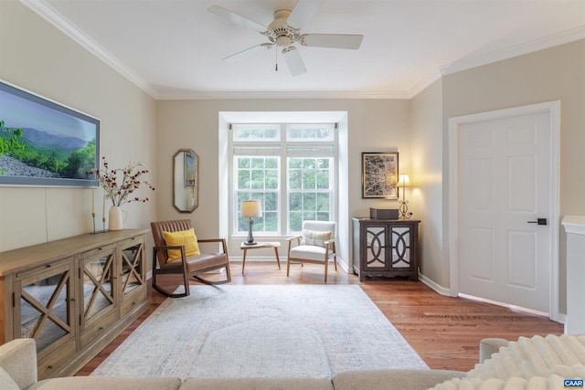 2667 Aldersgate Way, Charlottesville, VA 22911 - living area with wood finished floors, crown molding, a ceiling fan, and baseboards