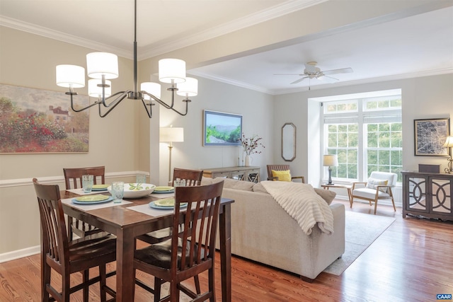 2667 Aldersgate Way, Charlottesville, VA 22911 - dining room with wood finished floors, a chandelier, ornamental molding, and a ceiling fan