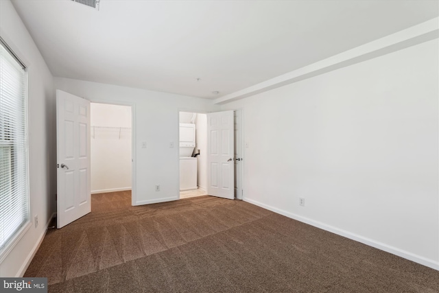 1136 Cove Rd Unit 202, Annapolis, MD 21403 - unfurnished bedroom with baseboards, carpet floors, a walk in closet, and a closet