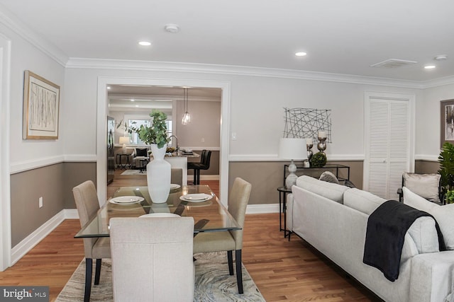 3402 Halloway S, Upper Marlboro, MD 20772 - dining area with light wood-type flooring, crown molding, baseboards, and recessed lighting
