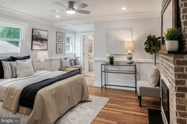 3402 Halloway S, Upper Marlboro, MD 20772 - bedroom featuring wood finished floors, crown molding, a brick fireplace, wainscoting, and ensuite bathroom