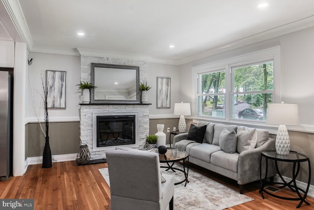 3402 Halloway S, Upper Marlboro, MD 20772 - living area with a fireplace, wood finished floors, baseboards, crown molding, and recessed lighting