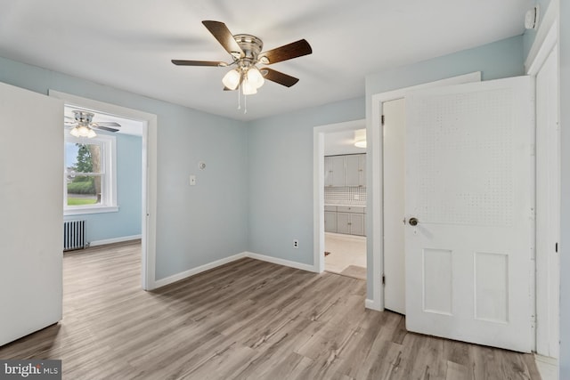 635 Elroy Rd, Souderton, PA 18964 - unfurnished bedroom featuring radiator, wood finished floors, baseboards, and ensuite bath