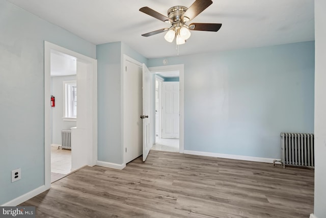635 Elroy Rd, Souderton, PA 18964 - unfurnished bedroom with radiator heating unit, wood finished floors, and baseboards