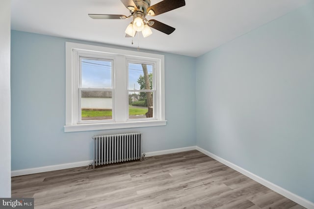 635 Elroy Rd, Souderton, PA 18964 - empty room with radiator, wood finished floors, baseboards, and ceiling fan