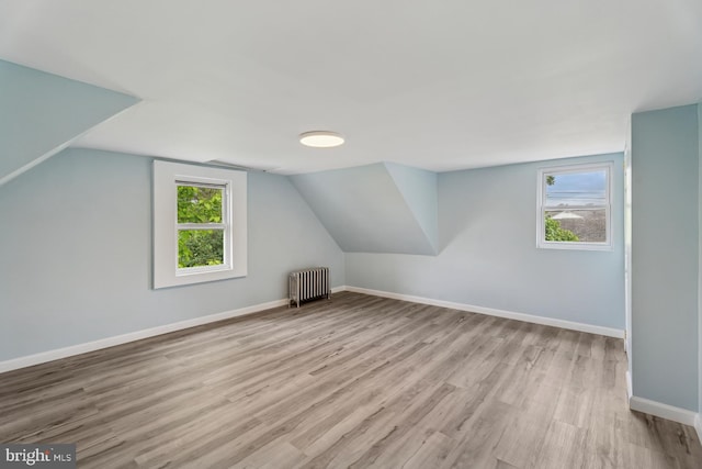 635 Elroy Rd, Souderton, PA 18964 - bonus room featuring radiator heating unit, wood finished floors, baseboards, and lofted ceiling