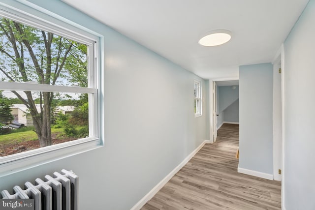635 Elroy Rd, Souderton, PA 18964 - hallway with radiator, baseboards, plenty of natural light, and light wood-style flooring